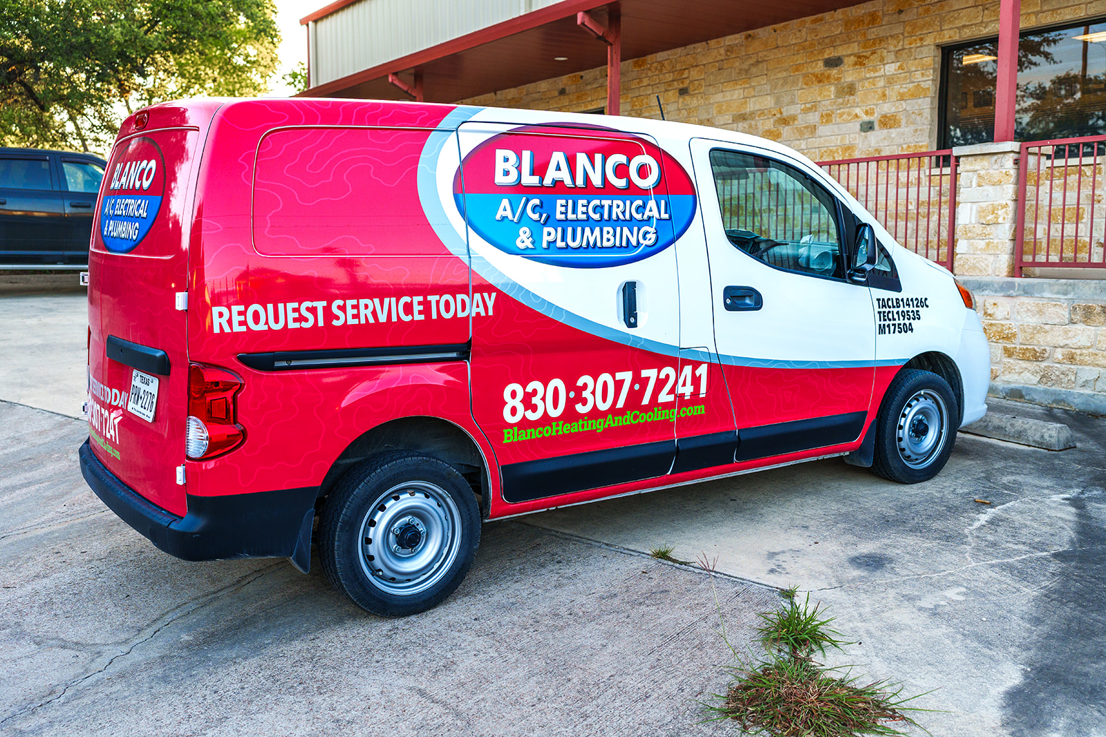 Blanco AC, Electrical and Plumbing truck parked outside the building helping with plumbing troubleshooting